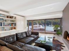  18-20 Sturdee Lane Lovett Bay NSW 2105 Laffing Waters ONLY TRUE NORTH facing waterfront Pittwater property on two titles with facility for 70' + boat. A waterfront property over 29 meters with sandy beach and features; Built over waters edge to the highest standard with amazing 180 degree views of Pittwater to Palm Beach, with sun all day in winter, and the north easterly sea breeze in summer. An amazing home that must be seen to be appreciated. * Ground floor features a modern kitchen, granite bench tops, Miele appliances and abundance of cupboard space. The open plan dining and lounge have sliding floor to ceiling windows open out onto a large cantilevered balcony over the water, plus a designer wood burning fire place. * Master bedroom with ensuite and spa, built-in robes, sitting room and adjoining study all with brilliant water views, a further two bedrooms and ensuite also with water views. * Self contained king size cabin with ensuite, surrounded by landscaped gardens, a separate alfresco dining pavilion with Danish wood burning fireplace. * Reverse cycle ducted / zoned air conditioning, town water, auto sprinkler system. General Features Property Type: House Bedrooms: 4 Bathrooms: 3 Indoor Features Ensuite: 1 Study Other Features Fireplace, Jetty, Storage, Waterfront, Waterview 