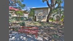  70 Blackmore St Windsor QLD 4030 Classic Cottage With City Views This home presents an outstanding opportunity for an investor or renovator with the added advantage for multiple use.. Overlooking perfect lawns of the Windsor Bowls Club and only a short stroll to Albion's finest restaurant strip or leave the car at home and hop on a train or bus. With the heart of the city only 4kms away. 3 good sized bedrooms Separate lounge room Private dining room off the kitchen Study Plenty of storage under 607m2 No need to struggle into South Bank to watch the News Years Eve fireworks you can watch them from the comfort of your home. Call today for an inspection. 