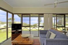  59 Gordon St Guilderton WA 6041 'Moore To Sea' The 'Moore To Sea' beach house at 59 Gordon Street truly captures the essence of what the small coastal town of Guilderton / Moore River is all about...a great place for 'digital detox', relaxation and reconnecting with the family without the stress of your everyday lifestyle.. Perfectly positioned just across from the round-a-bout (on the corner of Gordon & Edwards Street) that leads down to the foreshore, there is a great view of the ocean and estuary with the river, beach, General Store / Cafe and the Country Club and sporting facilities only a few minutes walk away - no need to get in the car 'til you leave! The light and cheerful coastal home is well maintained and offers a highly functional layout with a nautical vibe. The presentation is excellent - this is low maintenance holiday living at it's very best. A private rear deck in a peaceful landscaped garden setting completes the picture perfectly whilst a lovely front veranda will allow you to catch the breeze and take in the view. If you've been looking to combine the purchase of a holiday home with your long term investment plans, this is an excellent proposition as 'Moore To Sea' is one of the most popular short term rentals in Guilderton, generating a consistent return and repeat clientele year after year. Best looking, best position and best value - be quick for this one!  Please call Marg (0429 808 146) to arrange your own private viewing. 