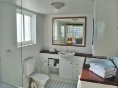  210 Surf Parade SURFERS PARADISE Qld 4217 AFFORDABLE & SPACIOUS and CLOSE to the NEW LIGHT RAIL  * One Bedroom One Bathroom Unit  * Floor Size Approx 55M2  * One Floor from the Top Level  * Brand New Carpet  * B/Corp $103 per week  * Council Rates $2488 per annum  * Sinking Fund Healthy Approx $500,000  * Holiday Letting Income Approx $25,000 per annum  ' Surf Parade Resort ' is a Boutique Building , of 9 Levels , exquisitely maintained to an extremely high standard .. Amazing Tropical Gardens lead to Heated Pool , Spa , Tennis Court , Gym , BBQ Lounge , Sauna whilst situated close to the Beach and Broadbeach.. Expansive views of the Hinterland and the Ocean . Five Star Resort Facilities , Immaculate Throughout ...First to see will buy . 