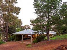 108 Chevin Road,	
	ROLEYSTONE WA 6111 OPPORTUNITY TOO GOOD TO MISS. Super value for 6.227 acres...Sitting 
proudly on one of Roleystone's unique hills prettiest natural bush land 
acreage properties. The home is deceivingly large and comprises four 
bedrooms, three bathrooms and study. A country charmer with its wrap 
around verandah and soaring raked ceilings. Several strategically 
located outdoor entertainment areas are perfect for those balmy nights 
and wonderful views. Adventure paradise for children to play. The property provides dual entrance the main entrance from Chevin and rear from Robinson Road. Enter
 through the main entrance at Chevin Road and the long driveway leads 
you to the luxury of this private gracious residence and tranquil 
lifestyle. Exuding wonderful family comfort boasting solid 
finishing's not found in the modern contemporary homes. A sanctuary 
from the busy working world. Room for multiple vehicles, truck, 
caravan, boat. Set amongst a natural bushland wonderland. The 
magnificent home boasts soaring raked timber lined ceilings, extensive 
feature brick and an ambience of country charm. Enchanting views from 
the Master bedroom and the Formal lounge room to the pretty natural 
garden, The fourth bedroom is a perfect teenager retreat/extended
 family room with its own bathroom and walk in robe. Classic open 
fireplace in the living room plus a slow combustion wood fireplace in 
the family room means you will never be cold and the property provides 
plenty of fire wood. 3 Sheds, 2 rainwater tanks, drinkable bore water, reticulated gardens and so much more. Only 5 minutes to Roleystone Hub, 15 minutes to Armadale Shopping, 38 minutes to the CBD. 