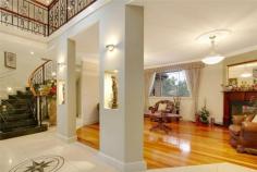  9 Adey Pl Castle Hill NSW 2154 Situated within 10 minutes walk from Castle Hill Towers Shopping centre 
is one of Castle Hill's finest locations 'The Precinct'. Conveniently 
located in one of the Castle Hill's most affluent cul-de-sacs, nestled 
away on 937sqm of prime land, amongst the peaceful natural elements, 
with its own exclusive private road entry. Beyond the discreet & 
disceptive facade of this truly magnificent property lies, an abundance 
of natural sunlight filled interiors, an impressive grand entry foyer, 
coupled with a sweeping granite staircase. This architechically designed
 Masterbuilt residence, built with practically in mind and without any 
expense spared, features luxuries and quality inclusions throughout, 
rarely found in any homes of today. Boasting six large bedrooms, 
consisting of four main bedrooms, all with ensuites & WIR's. The 
ground level also features a large main bedroom, ensuite & WIR, 
complimented with an another nearby full bathroom, a large open plan 
living/rumpus area, laundry, gym & sauna. Seven brilliant size 
contemporary bathrooms, in total. Simply perfect for accommodating 
either the In-laws, dual or multiple families, or guests in full luxury 
& style, which is extremely rare, anywhere throughout Sydney. Simplicity
 in design & perfection in the layout, the1st floor, boasts internal
 entry straight into the main open plan living area of the home, 
featuring a large adjoining balcony with breathless natural bush land 
reserve views, complimented with polished stone floors, a two way 
natural romantic gorgeous gas fireplace, a 'State of the Art' Kitchen, 
featuring European Stainless Steel Appliances, five burner gas stove, 
electric fan forced oven & range hood, D/W, large fridge space, an 
Island bench, and a separate large walk in pantry for the chef at heart,
 complimented with a nearby full bathroom & another full size 
bedroom, with ensuite, WIR, & balcony. A formal lounge & dining,
 all with brilliant backdrop reserve views. 