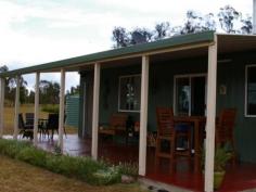  29 Ellerington Lane Amiens Qld 4352 Located just minutes from Stanthorpe this very neat 44 acre block offers
 privacy and comfort to enjoy the view, the wildlife and all that this 
district has to offer. The steel framed 28 x 7m house started its life 
as a shed but has been transformed into a comfortable 2 bedroom home 
nearly two years ago by a reputable builder with council approval. 
Featuring extensive insulation throughout, quality carpets and tiles, 
double glazed windows and doors, wiring for PC network, Foxtel and NBN 
ready, a 5.25KW Solar System with 21 panels, solar hot water and 2 x 
5000 gallon rainwater storage tanks. The property is nearly all fenced 
with 3 dams (1 springfed), mountain views right across to Bald Rock 
National Park, walking tracks and an abundance of wild flora and fauna. 
Offering a lifestyle many only dream of, this property could be yours. 
Contact Sally Rowen on 0417 633 969 to arrange an inspection. 