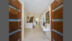 9 Menton Avenue, Varsity Lakes, QLD Come and experience the magic of Azzurra Island Varsity Lakes with its quiet streets and stunning park areas and see this wonderful large family home, which is as fresh as the day it was finished. It takes the concept of hassle free living in the suburbs to a whole new level. If you can find a lifestyle easier to enjoy than this we'd be very surprised. Within walking distance to Varsity College junior and senior school, shops and major transport route buses, this feature packed modern home is one you don't want to miss. Four living areas including mezzanine floor lounge, just beside a massive master bedroom means you can enjoy complete privacy. Great indoor - outdoor flow means you can entertain in style or to have a few friends over for a barbecue beside the pool. It will open your eyes as to how easy life can be and you will simply not want to leave. 4 bedrooms 3 Bathrooms Double Lock up Garage Fully landscaped in ground Pool Al fresco entertainment area Formal Dining area Gourmet Kitchen with Stone Benches Ducted Air Conditioning Security system Solar hot water 400sqm low maintenance Block