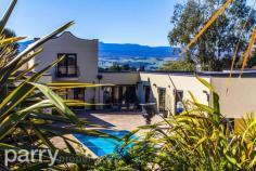  8 Ridgewood Ln Kings Meadows TAS 7249 Taking luxury to the next level this resort-style residence is more Beverly Hills  than Kings Meadows! This home provides the complete package that you've been dreaming of and within such close proximity to the Launceston CBD. Comprising of a formal entry, tiled flooring, pillars and water feature; glass doors off entry opening to an impressive courtyard and pool. Free flowing living, kitchen and dining areas with glass bi-fold doors, the kitchen boasts granite bench tops heated flooring, gas appliances. Glass bi-fold doors feature off the dining, also leading to pool and paved courtyard.  The ideal parents retreat upstairs, en-suite, plus balconies to enjoy expansive mountain and city views. 3 bedrooms off hallway, private with built-ins and access to pool and courtyard + fully self contained "Pool House", kitchen, lounge/rumpus, bathroom and bedroom. This home is an entertainers dream with an entertainment area for alfresco dining paved and undercover off the Pool House. All rooms are equipped for computer, TV, phone and ducted vacuum systems. There is a private home office with ample storage, a 3 car garage attached with remotes, hidden laundry and security systems. Luxury is everywhere with a saltwater pool, spa jets, solar heating, lighting, auto filtering, 12x9m approx shed, mezzanine floor, room for workshop, storage and toys. This grand home is expansively landscaped and driveways are equipped with stunning lighting systems. 