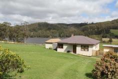  5090 Huon Highway Geeveston TAS 7116 Great Value With Priceless Views The renovations have just begun and this fantastic home is now available for you to make your mark. This wonderful home is situated on nearly 2 hectares of lush pastureland with views that will calm even the most highly strung and stressed person. From the oversized kitchen/dining area, you can simply sit and take in the tranquil water and mountain views. Or take a leisurely walk across the green pastures beside the dam, and just take in the serenity. The house features 4 double sized bedrooms, central lounge area and a large open plan kitchen and dining area. Recent renovations have revealed beautiful timber floors that are ready to be brought back to their former glory. The high ceilings create an added sense of space and light. There is a separate rumpus/sleepout that comes with its own pool table, great as a teenagers retreat or workshop for your latest hobby. With a little bit of work, you will have a magnificent home. 