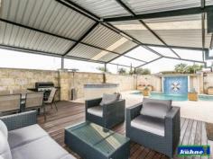  4 Kemp Pl Morley WA 6062 GRAND HOME OPEN SUNDAY 28th 12.00 to 12.45  A stunning home, designed and finished to the highest standard!  This immaculately presented 4 bedroom, 2 bathroom home is full of all the (I wants). As you walk through the entry you will find yourself surrounded by beautiful ornate ceilings with quality fixings and furnishings throughout. The master bedroom with walk in robe has an ensuite which was designed way before it's time with floor to ceiling tiles and is very luxurious. The 2nd & 3rd bedrooms offer ample room and have built in robes. The 4th bedroom is currently being used as the entertainment room with built in cabinetry and block out blinds.  The family bathroom also offers floor to ceiling tiles and is a modern master piece. As you enter in to the dining, kitchen and family areas which are open plan you look out over the stunning poolside retreat and patio areas, through glass sliding doors and windows that have all been furnished with ultra-chic roller blinds. The kitchen has been designed with a lot of thought for the astute cook and will simply take your breath away with its stone bench tops, top of the range appliances, dishwasher and design. This kitchen will be the envy of your friends.  The reverse cycle ducted heating and cooling will keep you comfortable all year round as will the comfort of knowing the home is well secure with security doors and alarm system.  As you step through the back sliding door under the huge gabled patio you will find yourself in your own little resort. The outdoor bar/ kitchen will be used year round as you sit back and watch the kids play in the heated sparkling pool in summer or the spa in winter or listening to the water features that surround the pool. 