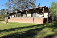  2441 Bucketts Rd  Gloucester NSW 2422 5 Bedroom home on 3 acres only 20 minutes east of Gloucester on the Bucketts Way. Immaculate presentation throughout this home which is surrounded by neat gardens and views to the creek and bush at the back of the property. Plenty of sheds, lots of rainwater, easy access and a convenient location make this a great package. The home features a well appointed kitchen, 2 living areas, 2 bathrooms, 2 air conditioners, a wood fire, a full length verandah and a screened sunroom. 
