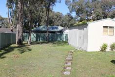 Positioned within a 5 minute stroll to Budgewoi Lake and situated on a 
large, level block of land this home offers a recently renovated kitchen
 and new exterior paintwork. 
An opportunity exists to build a granny flat for either dual income or extended family accommodation. 
3 Bedrooms 
Original main bathroom 
Combined living and dining rooms 
Renovated galley style kitchen with an abundance of cabinetry 
Split system air conditioning unit to living areas 
Covered outdoor entertaining deck 
Single drive through garage 
Large free standing shed 
Projected rental return $360.00 per week