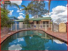 7 Pimelea St Everton Hills QLD 4053 Elevated with City Views 5 bedroom, 2 bathroom a huge family home with an in-ground salt water pool. The split level layout adds to the character and charm with all the bedrooms having built in robes. From the moment you walk in the door you will feel like you have stepped into a hidden Oasis with enough space to cater for a very large family and a perfect entertainer's paradise. Fully restored tiled roof and completely landscaped and fenced, you really have nothing to do but to enjoy your new home located close to everything. A must see as it won't last long... Features: * 5 Bedrooms with built-in robes * 2 modernised bathrooms * Salt water in-ground pool * Fully fenced level backyard * Functional kitchen with dishwasher * Large utility rumpus room * Loads of storage * Mixture of polished timber & tile flooring * Transport at your front door * Close to shops, schools * 7km to the city centre * City and Valley views * Many more surprises   Property Snapshot Property Type: House Zoning: RESIDENTIAL A(PR) Land Area: 607 m2 Features: Built-In-Robes