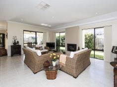  49 Pavilion Circle The Vines WA 6069 Your only local Real Estate Office, The Vines Real Estate offers the following quality home in a great location For Sale.  Immaculately presented 3 bedroom 2 bathroom home backing onto the golf course and with only one adjoining neighbour offers a haven of serenity, style and privacy in an exclusive location.  This is your opportunity to live in a quiet and secure area within strolling distance to The Vines Resort & Country Club.  If you are looking to downsize in size but not quality, then you need to view this superb home.     Theatre/TV room (easily converted to 4 th  bedroom if required) Wide foyer flows through to open plan living area with high 31c ceilings Main sitting area with built in gas fire place overlooks private side garden and opens to alfresco living Well appointed kitchen has abundance of cupboard and bench space, walk in pantry, s/steel appliances and views to rear Dining area opens to alfresco living under the main roof Delightful private king size master bedroom at the rear of the home with its own security door to outdoor garden and sitting area The master ensuite has double vanity, shower, corner bath and separate toilet 2 nd  bedroom is also king size and has a built in robe 3 rd  bedroom is queen size and has a built in robe Both minor bedrooms face the front with garden views and are serviced by the main bathroom and separate toilet/guest powder room Laundry with ample 3 door sliding linen and broom cupboard The stunning outdoor is a green haven with lawn and hedging giving it total privacy whilst maintaining views to the golf course and lake in the distance Double remote controlled garage has rear roller access, extra storage space and shoppers entrance to house Solar gas boosted hot water system, ducted air conditioning, 3 phase power, monitored alarm system, smart wiring Beautifully maintained gardens and lawn reticulated from mains Land area – 491sqm corner lot   For further details please contact PAM MITCHELL from The Vines Real Estate all hours on 0407 192 792 – YOUR DEDICATED VINES PROPERTY SPECIALIST – SERVICING YOUR IMMEDIATE AREA – DELIVERING PREMIUM RESULTS – LIVING AND WORKING LOCALLY 