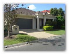  20 Riverwood Dr Ashmore QLD 4214 Located in the exclusive enclave “Riverside” of quality Nifsan built homes on the Nerang River, you will be impressed with the style, lay-out and finish.   It has 3 bedrooms plus study, the master being king size with large robe and ensuite with double vanity.   The open plan living, which encompasses a sunken formal lounge and a separate family area leading to the outdoor living, is very attractive with feature walls to make layout of furniture and display of your art and furnishings interesting.   The lounge has a cosy log fire to keep you warm this winter and a good pile of dried chopped wood is there too as a bonus.   The kitchen is well laid out with stone bench tops, a big corner pantry, and quality stainless steel appliances 