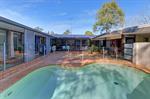  24 Chamberlain Rd Wyoming NSW 2250 Stunning Home, Large Block - UNDER OFFER OPEN HOME CANCELLED - Double brick architecturally designed home - Master bedroom with en-suite and spacious dressing room - Study or possible 4th bedroom - Open plan living designed around in-gound salt water pool and outdoor entertaining area - Immaculate kitchen with granite bench tops - Ducted air conditioning and vacuum - Huge double garage/shed, ideal for caravan, boat or large trucks with mezzanine storage, bathroom and 3-phase power - Double carport equipped with car wash drainage - Easy access to local shops and schools - Land size approximately 1,791 sqm with adjoining reserve Open home as advertised or call Amanda Woods to inspect 0418 248 989 amanda@wgroup.com.au General Features Property Type: House Bedrooms: 4 Bathrooms: 3 Outdoor Features Carport Spaces: 2 Garage Spaces: 5 
