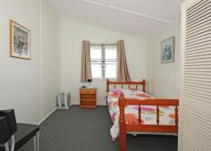  11 Burrum Street, BURRUM HEADS QLD 4659 Situated in Burrum Street within walking distance to Ross St boat ramp, lions park and shops. Highset queenslander in great condition. Recently has been re-roofed, fresh internal paint and new floor coverings. Central lounge and kitchen/ding area. There is two bedrooms with sleepout. Bathroom with shower and toilet cottage, underneath is car accommodation or storage and laundry facilities. The allotment is a high profile 1012m2 (1/4 acre) and has a fenced section for pets. There is a steel framed double garage with easy side access from the street. Happy Days has been a popular holiday rental home for many years, and is the ideal beach side holiday cottage. This position in town offers an excellent opportunity with a fantastic future. Furniture Package can be included by negotiation. 