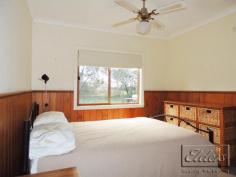  403 Sedgwick Road, Sedgwick VIC 3551 - Set on 2.5 glorious park-like acres, this beautifully presented property offers a serene lifestyle in tranquil surroundings with an amazing variety of trees and the seasonal Emu Creek meandering along its boundary. - The contemporary style weatherboard home sits at the end of a circular driveway and boasts new carpets throughout; a spacious open plan lounge with 10' ceilings and sliding glass doors on 3 sides, provides light filled rooms and beautiful garden views from every angle. 