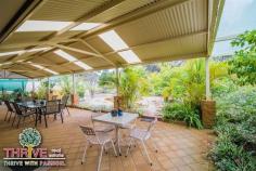  58 Dean Rd Jandakot WA 6164 PACK THE GOLF CLUBS....BRING THE FAMILY TOO! Web property id:  TRE150 You're invited to our HOME OPEN this coming SUNDAY from 12:00-12:40PM. This quality Ross North built double brick and tile home on a huge 717sqm block backing onto the fairway is the ultimate residence for the active family, and if you’re a golf aficionado you’ll be in seventh heaven! Complete with four large bedrooms, three bathrooms, formal lounge and dining, spacious open plan family/living and games, generous sized kitchen, children’s activity/study, big gabled alfresco entertaining patio, double lock up garage with rear roller door and garden shed on a fully fenced block with delightful established gardens including a variety of fruit trees; this is a very inviting home in a tightly held location. With 258sqm of living space, it truly is a substantial sized home, and additional features which enhance comfort and appeal include: cosy gas log fireplace, ducted evaporative air-conditioning, gas storage hot water system, tiled floors throughout for easy maintenance and a wonderful floor plan to facilitate separation of living – this is a home built to accommodate the needs of the modern family. An open plan kitchen with abundant storage, stainless steel appliances including 900mm gas oven and cook top, range hood, dishwasher and tiled splashback is a very functional design and there is ample room for a few helpers to assist without getting under the feet of the chef! Whilst there is so much living and entertaining space inside the home – it’s the huge covered alfresco patio that will attract visitors and is the perfect platform for all social occasions. As inviting as this home is throughout, it is equally lovely outside, framed by established vegetation with a large shady tree in front yard, plenty of room for a pool, the privacy of no neighbours at the rear and you can eat from your garden – avocadoes, mangoes, lemons, limes, plums and grapes! With a fully reticulated water system, maintenance is minimal...the hard work’s been done; you can just enjoy the fruits of someone else’s labour! Located in the ever popular and highly sought after Glen Iris Golf Course Estate, this is a quiet, safe, family-friendly neighbourhood close to all amenities including: Kwinana Freeway, Roe Highway, the new Fiona Stanley Hospital, shops and public transport. The golf course, clubhouse and Iris Restaurant are all at your doorstep...literally. It’s not too late to be in your new home prior to Christmas – enormous value on offer; act immediately. Proudly Marketed by THRIVE Real Estate with Derick & Bev PITT - We're Living & Selling on this Fabulous estate. 