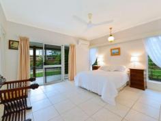  15 Agincourt Street PORT DOUGLAS QLD 4877 This tropical retreat inspired property, plus an additional stand alone home studio/office/seniors quarters/entertainment/rumpus area... Or just simply a 4th bedroom. With own bathroom and kitchenette needs to be viewed vigorously. As quality and design like this is in short supply and the high demand will have it sold quickly. 

Indoor & outdoor spaces combine as you gravitate to the outdoors, along sandstone pave ways through out your manicured gardens. Not only do you have a full length undercover patio to enjoy the serenity but a choice to stroll to your very own dedicated entertainment area capsulating water views and water fall feature across the pool from your alfresco dinning area. 

Large Gourmet kitchen, soaring ceilings & spacious entertainment areas. 
The home has upgrades not seen in normal homes of this nature. Along with the added advantage of the current owners passion for detail and on-going commitment in their pride of up keep.
 
On arrival, you will feel immediate security and that feeling of welcome and calmness. The modern space perfectly suited to the modern tropics. With 3 bedrooms and 2 bathrooms in the main residence.
Your master bedroom en-suite, having an impressive WOW factor as you walk in. Along with ability to open your master bedroom out to the full length patio . Over sized double-car lock-up garage plus an additional undercover auxiliary arrival car bay. Great built in storage, linen, robes and quality finishes and features throughout. 