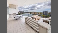  50/98 Thorn St Kangaroo Point QLD 4169 Spacious Penthouse Enjoy the benefits of a house sized property with the convenience of apartment living and special location. Perfect North east aspect to showcase expansive water, Story Bridge, CBD and park views.  -Modern lines with soaring ceilings and unique architectural elements.  -465m2 on title -Wrap around balcony -Private lift access -Ultra quiet serene inner city location.  -Fully ducted and zoned air conditioning -3 side by side parks -Ample storage in basement with 3 storage lockers in secured basement  -Separate family sized laundry  -Motorised blinds and curtains. Open plan entertainers kitchen features stone bench tops, Miele appliances with built in coffee machine and temperature controlled wine storage cellar facility. Front balcony flows seamlessly from formal lounge and is suitable for large scale entertaining and features built in BBQ kitchen with sink and commercial smoke extraction.  Master bedroom features curtain glass walls to take advantage of stunning view. Walk in wardrobe is large enough for all your clothes. Ensuite is fitted out with bath, stone tops and polished tiles.  Adjoining separate study also enjoys panoramic water views.  A separate wing houses the very large 2nd and 3rd bedrooms, guest bathroom and laundry.  Exclusive complex features pool, spa, gym and top class management.  Airport tunnel entrance point is a convenient 100m drive and there are no traffic lights to the CBD.  Stroll along the waterfront boardwalk to Mowbray Park which has a city cat stop and is across the road from restaurants, cafes and shopping. Call Justin Smith on 0438143691 to view today. 