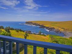  20 Elanora Road Kiama Heights NSW 2533 Ocean Front Indulgence! Being offered for sale for the first time in 25 years is this sophisticated property positioned overlooking the stunning Kiama Heights Bay! This large home is deceiving from the front, but as you walk in the entry level there are 3 large bedrooms spread out all with BIWs, a large bathroom with separate spa and also a separate toilet.  As you travel up one level you are welcome by the stunning view of your balcony overlooking the waves crashing on the rocks of the Bay and the picturesque view of the livestock roaming around the headlands. Sit back and relax in the large living area with bar area as you watch the dolphins and whales pass by below! On the lower level you are lucky enough to be able to stand in the large gourmet kitchen and prepare a meal whilst once again being able to enjoy the expansive view from the large bay window. This level also offers a generous sized sitting and dining area with access to a full balcony to enjoy the beautiful sea view. From this lower level you can access the contained main bedroom suite with WIR and ensuite, plus access to another balcony again taking in this stunning view! General Features Property Type: House Bedrooms: 5 Bathrooms: 3 Indoor Features Ensuite: 1 Outdoor Features Garage Spaces: 2 Open Car Spaces: 1 
