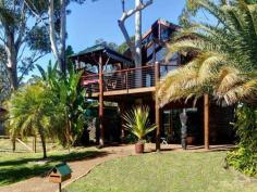 40 Koonwarra Dr Hawks Nest NSW 2324 Property Details Price 	 $990,000 State 	 NSW Region 	 Port Stephens Suburb 	 Hawks Nest Postcode 	 2324 Property Type 	 House Bedrooms 	 4 Bathrooms 	 2 Carspaces 	 1 Land Size 	 556 Square Metres Perfectly situated to capture wonderful views. A stones throw to the waters edge and overlooking on the huge nature reserve, the ultimate carefree lifestyle. You can almost touch the water from this thoughtfully designed riverside home. The views are just lovely from nearly every angle of this home.  Open planning of the home allows for easy entertaining, spilling outdoors to the front deck with magic views. Soaring cathedral ceilings and expansive use of glass on the upper level capture the bay and Myall River views. Stand by the sandstone fireplace, in the well appointed kitchen or spacious dining area and you’ll enjoy the stunning vistas. The top storey comprises two bedrooms, with the oversized master suite overlooking the waterfront with its very own private balcony, spacious walk in robe and huge ensuite complete with sunken spa bath , open plan lounge and dining, modern kitchen are finished in beautiful timber . The front deck is perfect for entertaining and taking in the views. Downstairs features the 3rd and fourth bedroom complete with second living room, again with water views. The sheltered patio completes the picture, with room for every one to enjoy this fabulous location. The carpentry of the exposed timber work is of cabinetmaker standard. The selection of timbers is complimented by the extraordinary workmanship. The home captures the northerly breezes and fabulous water views. Built in western red cedar it is surrounded by gum trees and tropical gardens which are irrigated by bore water. Inspection is a must!!! "We have obtained all information in this document from sources we believe to be reliable; however, we cannot guarantee its accuracy. Prospective purchasers are advised to carry out their own investigations…" 