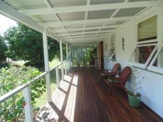 61 Charles Street
KENILWORTH Qld 4574 This 4 bedroom home is a Cracker.....  New Kitchen  Formal lounge & spacious family room  2 bathrooms & toilets  Covered front verandah  Enormous covered deck with great views  Hardwood chamferboard on exterior walls  Double carport and double roller door garage for 4 cars on 800m2 