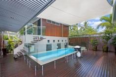  21 Upolu Esplanade Clifton Beach QLD 4879 Superior Architecturally Designed Beachside Residence House - Property ID: 711221 This stunning executive style home has been architecturally designed to allow for a multiple of uses - family or holiday home, work from home situation or retired couple. Located right on the Esplanade - short stroll to the beach, parkland and walk ways. The whole package is simply outstanding - the right location with one of the best designed houses we have inspected in years. * Absolute quality construction inside and out, utilizing a blend of different timbers, iron and block. * Yes! this is a Circa 2000 - David Quigley Home. * Unique pavilion style and fully air-conditioned. * Fully self contained guest pavillion. * Stunning open air outdoor entertaining area with spotted gum timber deck and shade sail - providing full protection from the weather. All rooms of the home open up onto this beautiful internal surrounding. * 3 large bedrooms plus the guest room, with main bedroom overlooking garden & winter creek. * 3 bathrooms including stylish ensuite to main bedroom. * Built ins to all bedrooms with the main containing a huge walk in robe. * Modern kitchen with gas cook top, Meile appliances incl dishwasher, soft close cupboards and durable stone bench tops. * Open plan living room containing full length side views to garden and winter creek, built in electronic cupboard - ideal to hide all those wires and components. * High ceilings and openness created through out due to the Riteck roof system. * Well designed for the tropics with cross flow ventilation via full length opening windows and louvers. Being elevated off the ground also allows for underneath air flow. * Cool modern heated freshwater pool situated in the middle section of the home and deck area - pool also has 3 waterfalls. * Large internal laundry with 9 cupboards. * Double lock up garage with extended work shop area, plus double side gates for boat/camper trailer parking. * Guest room is multipurpose and could easily be used as office, gymnasium, fourth bedroom or rent it out separately as it has its own private entrance. * Seller will rent back for 12 months. The sellers instructions are to sell now as they wish to create another amazing dream home nearby. This property is very unique and functional so inspect today and secure your private paradise.  Print Brochure Video Email Alerts Features  Land Size Approx. - 600 m2 