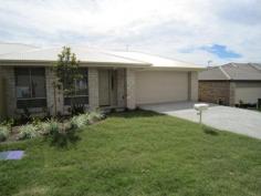  2/12 Prewett Street Upper Coomera Qld 4209 A modern, stylish and spacious, 3 bedroom home with open plan living and dining areas awaits you. There is quality fittings throughout including ceasar stone bench tops, stainless steel appliances including dishwasher. There is an ensuite and walk-in robe to the master and a separate laundry in the garage area. Tinted windows & sliding glass doors add to the comfort of the home as does the quality carpet in the bedrooms and tiles throughout the rest of the home. 