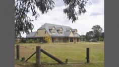  35 Hawkshill Road Canyonleigh NSW 2577 Exercise Your Options Two homes or one home and a bed and breakfast OR one large country manor ........ the choice is yours or perhaps you are looking for a country home with room for your guests. This two storey sandstone manor is a clever blend of architectural design and rural ambiance consisting of the following  * 6 bedrooms, 6 living areas, 4 bathrooms and 2 gourmet kitchens * Light filled rooms with high ceilings * Spacious dinning rooms * Billiards room * Polished timber floor boards * Wide French doors and large verandahs * 8 bay car space The property consists of approx. 40H (100 acres) of land currently being used to breed alpacas. It has a rustic Manger's cottage and unlimited potential....... * Rich fertile soil * Good rainfall * Machinery sheds * Dams * Fenced paddocks * Gently undulating land This property is a rare find, half way between Canberra and Sydney it is a must see for any discerning buyer of quality estates. Call Rick Mooney on 0419 310 059 to view this magnificent property. General Features Property Type: Acreage/Semi-Rural Bedrooms: 6 Bathrooms: 4 Building Size: 94.00 m² (10 squares) approx Land Size: 36.54ha (90.29 acres) (approx) Indoor Features Toilets: 5 Outdoor Features Garage Spaces: 8 Other Features Built-In Wardrobes,Garden,Secure Parking,Polished Timber Floor,Formal Lounge 