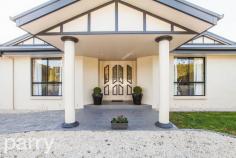 32 Vrouka Place HADSPEN  TAS 32 Vrouka Place is located in the small township of Hadspen only 9 minutes commute to Launceston's CBD. At the end of a quiet cul-de-sac you will enter a long internal drive and arrive at this grand residence. The house is perched on the side of the hill accessing full views of the South Esk River. The home sits on 7683 square meters of land with side access down to the river where there are numerous walking tracks. This large family home is approximately 36 square meters and is constructed with a brick render finish, inside there are 4 good-sized bedrooms all with built in wardrobes. The master bedroom features a huge walk in robe and a luxury corner spa in the en-suite. There is plenty of room at both the front and rear of the property, if you're using the rear of the property it could be great for a large family pet such as a horse or some sheep. There is already a double garage with internal access, however if you are looking to expand this storage space, the front of the property has great potential for further garages or sheds. With its timeless elegance, this home flows seamlessly through multiple living areas, great for separating the kids while the parents entertain. The kitchen is situated at the hub of the home with granite bench tops and surrounded by polished timber floorboards that flow through to the dining and lounge areas. 