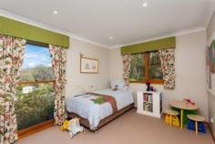  58 Slocombe Street Goulburn NSW 2580 This impressive solar passive designed, north facing, four bedrom plus study, multi-level home, with spectacular views from every room, is set on one acre of established gardens on the upper side of Slocombe Street.   Open-plan living incorporates kitchen with breakfast bar and walk-in pantry, a dining area and a lounge room overlooking the  split level family room. Master suite includes bedroom with balcony, walk-through wardrobe, en-suite with shower, parents’ retreat and access to the study that offers complete privacy on the top floor. 