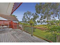 63 Pacific Crescent Maianbar NSW 2230 This premium waterfront family home, boasting spectacular north facing views across Port Hacking, provides an extraordinary retreat with a holiday feel everyday of the year. Bathed in sunlight all year round, this 3 bedroom cedar home with sandstone features is only 1 hour from Sydney CBD. Recently refreshed with crisp neutral interiors and stylish Venetian blinds, this coastal home has a seamless flow floor plan from front to back. Extending to the outdoors, the living areas with timber floors are adjacent to a spacious gas Smeg kitchen with modern appointments, a large pantry and water views. Enjoy alfresco dining on the deck with breath-taking views, or step off the child friendly lawn to swim, kayak or fish. There is a separate self-contained studio area with small north facing deck. · 3 bedrooms, master with ensuite and built in wardrobes · Timber floors in living areas, open to deck · Built-in flued wood heater · Separate studio with bathroom and kitchenette · Level lawns extend to water’s edge · Carport · Set in 834sqm   Property Features:     4 Bedroom     3 Bathroom     1 Storage     1 Living Room     1 Ensuite     1 Formal Dining     180m2 Building Size     Double Brick Construction     1 Parking     834m2 Land Size     1 Backyard     2a Zoning     Views     1 Upstairs Living     1 Alfresco     1 Rumpus     1 Informal Dining     1 Sun Room 