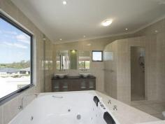 5 Mallard Ct South Gladstone QLD 4680 Stunning Contemporary Abode - Close to CBD Have
 you been searching for a home with a touch of distinction and high 
quality finish? Looking for a home in a popular estate that would be a 
great place to raise your children and close to local schools and 
shopping precincts? Do you want a home of the highest quality built by 
one of Gladstone's leading Master Builders? Can you see yourself living 
in a stylish contemporary home with two separate living areas on a 
convenient 910m2 approx. block of land, giving everyone in the family 
their own space and room to move in a large 421m2 approx. modern home..? Well here it is.... ready for you to call this stylish property "Home", today! This
 stylish family home is of the finest quality and is situated in one of 
Gladstone's most popular residential precincts of Catalina Heights 
Estate. Offering 4 bedrooms + study(master suite has resort styled 
en-suite, walk-in dressing room and private balcony with panoramic 
views), contemporary styled kitchen, open planned dining and family 
rooms, separate home theatre, tiled entertainment area overlooking the 
private rear yard and pool. Double lock-up garage plus ample storage 
space and utility room with en-suite! Built by one of Gladstone's 
leading master builders this home is guaranteed to be popular so call 
the marketing agent today to arrange your private viewing as soon as 
possible......Inspection is highly recommended..! Sale By Auction Marketing Agent - Steven James Mobile 0439 111197 Office 07 4976 8021   Property Snapshot Property Type: House Construction: Concrete Block House Size: 450.00 m2 Land Area: 910 m2 Features: Built-In-Robes Close to schools Dining Room Dishwasher Ensuite Family Room Lounge Outdoor Living Pool Security Screens Storage Study Verandah Walk-In-Robes Waterview
