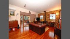  228 Swansea Road, Mount Evelyn, VIC 3796 This large three bedroom home is remarkable in the size of all the rooms are all BIG BIG BIG. Large proportion is the essence of this home. Walk into the large, open plan lounge with dining, high ceilings, polished floors and beautiful feature leadlight windows and doors, gas ducted heating a wood fire for cosy. Double doors onto a large balcony for outdoor entertaining and pink sunset skies. The stylish new kitchen has vast cupboard and bench space, self closing drawers and stainless steel appliances. A great sense of sharing the good space in an island work counter as extra. An adjacent utilities room adds to this working zone. A second living room through double doors then onto the three bedrooms (main with ensuite). Main bathroom with spa bath and guest powder room. A sizeable 1545 sq metre block (approx.), garaging, workshop, carport, there is much about this home that will suit a family. Make this one yours. 