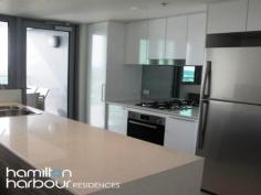 10701 8 Harbour Rd HAMILTON Qld 4007 This spacious 2 bedroom, seventh floor apartment overlooking Hamilton and Eagle Farm Race Track really does have it all. This floor plan has a beautiful open plan layout with large living and dining area that is accentuated by the double glazed floor to ceiling doors embracing the morning sun. The modern kitchen is equipped with European appliances - gas cook top, electric oven and dishwasher plus plenty of bench and cupboard space has direct access to the balcony making it perfect for dining and entertaining with ease. The master bedroom has a separate ensuite, with the second bedroom boasting views up the Brisbane River. Both of which are queen sized. The laundry is cleverly hidden behind closed doors and the main bathroom includes a bath tub for complete relaxation. This is a Pet friendly complex. Located in the hub of the Hamilton Harbour Precinct and 3 minutes walk to Racecourse Rd Village, Brett's Wharf and Portside, you will be in the centre of all the local dining, entertainment, shopping, medical and community services. Close to a variety of public transport options including the BCC City-cat and ferries, trains, bus stops, airports and arterial roads, going places is a breeze. 