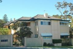  5/74 STIRLING HIGHWAY, NEDLANDS WA 6009 Rooms to Spare! Like a little house in the sky, with an internal floor area of 92sqm, this first floor apartment has a lounge/dining room, sunroom, two bedrooms, study, kitchen, bathroom and private balcony. Although a Stirling Highway address, it is located at the quieter rear of the building, which contains only five units, on the corner of Stanley Street. As the building was constructed around the 1930’s, this apartment has the character features typical of that era: timber floors, high ceilings, timber joinery, french doors and an open fireplace in the lounge. 