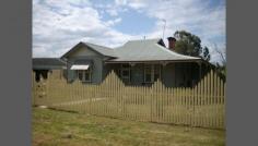  15 Sladen St East Henty NSW 2658 Federation Cottage - Fully Renovated & Extended Very neat 3 bedroom, 2 Bathroom fully renovated cottage on a large block. House has been re-stumped, painted throughout. Gourmet kitchen featuring Falcon Stove with 4 burner gas top, & wok burner, plate warmer, island bench with sink & soft-touch pantry cupboards.  House is cooled by ducted refrigerated air-conditioning and heated with ducted natural gas.  Property has rear access with a large two vehicle garage plus parking. Ideally located within walking distance to shops, schools and train station. 40 Minutes to Albury and Wagga, and daily train services to Albury, Wagga, Melbourne & Sydney. Henty is well serviced with schools, local hospital, aged care and sporting facilities. General Features Property Type: House Bedrooms: 3 Bathrooms: 2 Land Size: 1200 m² (approx) Indoor Features Ensuite: 1 Living Areas: 1 Toilets: 2 Gas Heating Ducted Heating Ducted Cooling Air Conditioning Outdoor Features Secure Parking Garage Spaces: 1 Deck Shed Fully Fenced Other Features Close to Schools,Close to Shops,Close to Transport,Garden,Secure Parking,Polished Timber Floor 