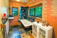  20 Bailey Street Repton NSW 2454 Unique, Peaceful and Leafy This two storey brick home is located in a quiet leafy street in Repton with access to the Bellinger River only 150 metres away!  The solid two bedroom home features internal brick walls, a spiral staircase, polished timber floorboards and leadlight windows throughout. Upstairs you will find the functional timber kitchen with a bay window and gas stove/oven.  Also, a comfortable lounge room with access to the verandah, reverse cycle air conditioning and a slow combustion fireplace will keep your home warm in the cooler months. Downstairs are the two good sized bedrooms with ceiling fans, a study hutch and laundry with second toilet. Step outside onto your wide verandah that wraps around the entire home which will be great for entertaining or chasing the sun! A child friendly fenced back yard with rear lane access and paved landscaped surrounds complete the picture on this desirable home. Located a short 5 minute's drive to North Beach in the quaint town of Mylestom and 22 minutes to Coffs Harbour airport, this cosy and unique home in a great location is on offer for you. Two storey, 2 bedroom brick home General Features Property Type: House Bedrooms: 2 Bathrooms: 1 Land Size: 398 m² (approx) Outdoor Features Garage Spaces: 1 