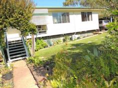  8 Marlin Street, TOOLOOA QLD 4680 Hidden behind a high front fence you will find this lovely property. It is surrounded by beautiful gardens and has a great tranquil feel about it! - lovely polished floors throughout - air-conditioned living area - fabulous kitchen with loads of cupboard space - gas cooking & gas hot water - extra large air-conditioned main bedroom - very neat bathroom with shower over bath - house is cladded for easy maintenance - fully fenced flat yard - beautiful landscaped gardens with lovely trees - great cubby house in the backyard for the kids with dog house underneath - garden shed in backyard 