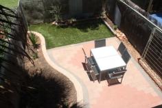  57/111 Bloomfield St Gillen NT 0870 This unit is located in the Gap Estate which is approx. 3.2kms from the town center. The complex itself has a large swimming pool to relax during the warm summer days. The two bedroom townhouse is neatly presented with open plan living area downstairs and split system air conditioning. All furniture is in good condition and includes couch, study desk, white goods and bed. Upstairs there are two bedrooms with built-ins and split system air conditioning. The second bedroom has a balcony with views of the ranges. The bathroom has shower, toilet and vanity. Downstairs you have a private courtyard that is beautifully designed with paving, artificial grass and a garden bed. A great place to have BBQ while you enjoy the views of the ranges. Undercover parking out the front and only side neighbours is very appealing. 