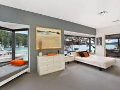  18-20 Sturdee Lane Lovett Bay NSW 2105 Laffing Waters ONLY TRUE NORTH facing waterfront Pittwater property on two titles with facility for 70' + boat. A waterfront property over 29 meters with sandy beach and features; Built over waters edge to the highest standard with amazing 180 degree views of Pittwater to Palm Beach, with sun all day in winter, and the north easterly sea breeze in summer. An amazing home that must be seen to be appreciated. * Ground floor features a modern kitchen, granite bench tops, Miele appliances and abundance of cupboard space. The open plan dining and lounge have sliding floor to ceiling windows open out onto a large cantilevered balcony over the water, plus a designer wood burning fire place. * Master bedroom with ensuite and spa, built-in robes, sitting room and adjoining study all with brilliant water views, a further two bedrooms and ensuite also with water views. * Self contained king size cabin with ensuite, surrounded by landscaped gardens, a separate alfresco dining pavilion with Danish wood burning fireplace. * Reverse cycle ducted / zoned air conditioning, town water, auto sprinkler system. General Features Property Type: House Bedrooms: 4 Bathrooms: 3 Indoor Features Ensuite: 1 Study Other Features Fireplace, Jetty, Storage, Waterfront, Waterview 
