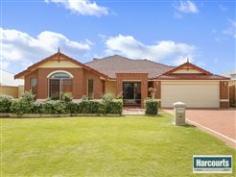  42 Conti Road Tapping WA 6065 If you're looking for space and a home that grows around the family then you've definitely found it with this Celebration home. A large games room that'll keep the kids entertained for hours and a spacious theatre room at the front of the home for those family movie nights. Everything in this home is on the large side even starting from the double door entrance. All bedrooms are large with built in robes and the master bedroom is huge with walk in robe. The ensuite has a spa where you can relax in the bubbles with a glass of champers. There's room to cook for 5000 in the large open plan kitchen which over flows into the family dining area. The outdoor under cover area is ideal for taking shelter from those hot sunny days and a grassed area which is ideal for the kids and pets to play or potential room for that pool. The Brady Bunch would be happy with this one! Easy reach to Carramar Shopping Centre, Drovers Market and a short 7 minute drive to the freeway (approx). - See more at: http://premier.harcourts.com.au/Property/580058/WPM3854/42-Conti-Road#sthash.CpI01VlO.dpuf 