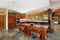  97 John Oxley Dr Frenchs Forest NSW 2086 WOW!!- THIS IS SOMETHING VERY SPECIAL & ON LEVEL 1176sqm TOO!! 6 4 2 If you are looking for quality, lifestyle and space, then this is what you are looking for! Exclusive residence of 'Grand proportions' in sought after John Oxley Drive. Huge 1176sqm level block on the high side of the street. 6 extra large Bedrooms most with access to wrap around verandah, (three of which are 20ft x 20ft with built-in cupboards and solid timber desks). The Master bedroom boasts a large walk-in-robe and dressing room, ensuite with double shower, double jet spa-bath, double vanity and dressing table. 4 Bathrooms in total featuring lead light windows, 2 with full sized spa baths. The large Open Plan eat-in kitchen captures the morning sun and looks out over the pool and gardens. Adjoining lounge room, with feature raked stained timber ceiling, opens out to huge undercover alfresco entertaining & BBQ area, salt water solar heated in ground pool, cantilever sun umbrellas and spacious low maintenance landscaped gardens with plenty of room for children to play or adults to party!! Watch the latest movies in your own home Movie theatre with wall size screen or work out in the large gymnasium with mounted TV. Separate study (home office) or library and extra large laundry. Other features include: quality fixtures, fittings and electric blinds throughout, high ceilings, mesh leaf guard on all gutters, Chatswood, district and Garigal National Park views, 19 Solar panels(earning approx. $1,000 quarterly return - don't pay another power bill, let them pay you!), 5 water tanks totalling approx. 21,000 litres Bus stop at rear to city and Chatswood  Close to schools, shops, Chatswood, City, beaches and new hospital, beautiful bush trails/walks. To inspect contact Iain Mackinnon 0412 360 945 or Fiona Davies 0405 588 224. Property Features Swimming PoolBuilt-In WardrobesClose to SchoolsClose to ShopsClose to TransportFireplace(s)GardenTerrace/Balcony 