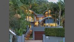 2053 Pittwater Rd Bayview NSW 2104 Set on 1448sqm of impeccably presented grounds with all day sunshine, Baybreeze enjoys virtually touchable views of the brilliant boat filled Pittwater. It also has the distinct advantage of being able to offer expansive secure gardens where lush green lawns compliment exceptional poolside entertaining within a private setting. Open plan living, floor to ceiling glass flows to terraces Master suite in private wing with views to Scotland Island Ensuite with dual marble vanity, underfloor heating, spa bath New gourmet kitchen, European appliances, Carrara marble bench tops Separate home office or guest area with bathroom 1448 sqm of landscaped gardens, level grass area ideal for children Ducted reserve cycle air-conditioning and views to Palm beach lighthouse Heated saltwater pool, cabana, wet bar, spa and sauna Security intercom, automatic watering, outdoor lighting