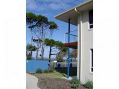  7 / 26 Esplanade  Tin Can Bay  Queensland 4580 Executive style 2 storey 3 bedroom villa with 2 bathrooms, 3 toilets and 2 car accommodation. Spacious open plan living, kitchen with granite bench tops, stainless steel appliances and dishwasher. Master bedroom ensuite has a spa to relax in, bedrooms have built-ins and ceiling fans. Enjoy the privacy of your own courtyards and 2 balconies and views. 170sq m. The view can never be built out. Close to Tin Can Bay Marina. 