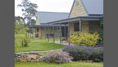  35 Hawkshill Road Canyonleigh NSW 2577 Exercise Your Options Two homes or one home and a bed and breakfast OR one large country manor ........ the choice is yours or perhaps you are looking for a country home with room for your guests. This two storey sandstone manor is a clever blend of architectural design and rural ambiance consisting of the following  * 6 bedrooms, 6 living areas, 4 bathrooms and 2 gourmet kitchens * Light filled rooms with high ceilings * Spacious dinning rooms * Billiards room * Polished timber floor boards * Wide French doors and large verandahs * 8 bay car space The property consists of approx. 40H (100 acres) of land currently being used to breed alpacas. It has a rustic Manger's cottage and unlimited potential....... * Rich fertile soil * Good rainfall * Machinery sheds * Dams * Fenced paddocks * Gently undulating land This property is a rare find, half way between Canberra and Sydney it is a must see for any discerning buyer of quality estates. Call Rick Mooney on 0419 310 059 to view this magnificent property. General Features Property Type: Acreage/Semi-Rural Bedrooms: 6 Bathrooms: 4 Building Size: 94.00 m² (10 squares) approx Land Size: 36.54ha (90.29 acres) (approx) Indoor Features Toilets: 5 Outdoor Features Garage Spaces: 8 Other Features Built-In Wardrobes,Garden,Secure Parking,Polished Timber Floor,Formal Lounge 