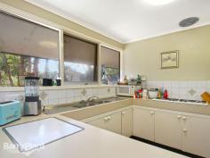 Positioned in the Bowling Green Estate Spectacularly set 
against an impressive backdrop of trees in a quiet and picturesque court
 setting in the desirable Bowling Green Estate, just a short drive to 
central Boronia amenities, this promising residence delivers exceptional
 appeal to first homebuyers, investors, renovators and those searching 
for the perfect location to build their dream residence (STCA). Privately
 set upon a lush allotment of a generous 937sqm (approx.), the home 
offers a spacious living area enjoying a large open fireplace ideal for 
those chilly, wintry evenings, and a split-system air-conditioner 
ensures comfort in the warmer months. Parquetry flooring features in the
 sizeable meals zone, original kitchen with gas cooking and family zone 
enjoying timber French doors opening out to the paved patio and 
flourishing gardens. The main bedroom is ideally complemented with
 extensive robing and a full en suite, while two further bedrooms, both 
with built-in robes share the central bathroom and separate toilet. A 
fitted laundry, ample storage, pet door, two storage sheds, plentiful 
off-street parking and a front covered verandah concludes. Located
 on the fringe of Ferntree Gully and Boronia, in a conveniently close 
proximity to a variety of shopping options, cinemas, bowling alley, 
station, cafes and restaurants, amenities and station, a walk to primary
 schools and reserves, easy access to Westfield Knox and EastLink, as 
well as children's playground and parklands directly adjacent. Providing
 a sensational first home where you can update and style to your tastes,
 invest in a favoured pocket of Boronia, renovate or start afresh and 
envision the home of your dreams in this scenic, family-friendly court. 
Enquire today! Photo ID Required 