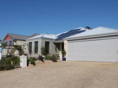  36 Gosford Meander Ashby WA 6065 NEW TO MARKET- Just put your furniture down in this large, immaculate home. Boasting four double bedrooms two bathrooms and a study. Newly renovated kitchen with fabulous granite workbenches, solid wooden doors and lots of storage. Reverse cycle refrigerated air con throughout, quality tiles, carpets, fixtures and fittings .Sensational entertaining area with a beautiful, sparkling below ground pool with glass fencing, which is totally private. Solar heated hot water and solar panels on the roof to cut right down on electricity bills. Powered brick workshop. Alarm system and lots of extras!  This gorgeous home is surrounded by other top quality homes, is a pleasure to present and is sure to impress! 