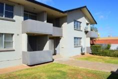  UNIT 6/25 HANNAN STREET KALGOORLIE WA 6430 THE CITY ON YOUR DOORSTEP This conveniently located unit is situated on the top floor of the apartment block with views of the bustling lifestyle that is Hannan Street, Kalgoorlie. The modern two bedroom unit features good size bedrooms both with built in robes, modern bathroom with vanity, shower and separate toilet. The open plan living, dining and kitchen area is contemporary with floating wooden floorboards, large windows and the comfort of reverse cycle air-conditioning. The kitchen features electric cooking, dishwasher and pantry with a swiss laundry located...  2 Bedrooms with BIR 1 Bathroom with separate toilet Open plan living, dining and kitchen Electric cooking and HWS Swiss laundry Single carport and storage room Communal decked patio with BBQ Complex of 8 