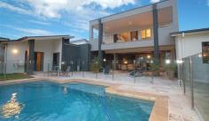  8-10 Kambah Pl Reedy Creek QLD 4227 STYLE FOR HARMONIOUS INDOOR/ OUTDOOR LIVING $999,000 Web property id:  CBS583 Elevated within the heart of ‘The Observatory’, this master built Sanctuary 28 residence presents two levels of contemporary living appointed to the highest standards. Enjoy the peaceful park surroundings.  • Beautiful formal lounge/dining area has spotted gum floors • Entertaining area enjoys a sparkling pool outdoor shower and park views • Caesar Stone bench tops, kitchen equipped with Smeg appliances • Family bedroom wing enjoys a stylishly appointed bathroom • Top floor main has an opulant ensuite and a large deck overlooking Surfers Skyline views.  • Sounproof hobby/rumpus room plus an Italian tiled family living area • Air conditioned, Vacuum Maid, intercom and surround sound • Toowoomba sandstone paving plus landscaped gardens and lawn • Triple car garaging, plus extra space for a van/boat • Set on a 1,143sqm block opposite parklands Located within minutes drive to private and public schools, public transport, Varsity Train Station ,Local Shopping Centre and 20 mins to Burleigh Beach. 