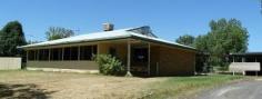  101 Louisa Street Mitchell QLD 4465 FAMILY HOME WITH RIVER VIEWS 3 Bedroom home (built-ins in main bedroom), Hallway (with built-ins), Bathroom (with both bath and separate shower), Separate Toilet, Family Room, Laundry (with built-ins), Sunken Lounge Room, Kitchen/Dining Area (with benchtop and electric stove). Concrete, undercover patio area at rear.  2 bay Garage with power connected, and storage room at rear. Fenced 2937 m2 block, with established lawns and trees. General Features Property Type: House Bedrooms: 3 Bathrooms: 1 Land Size: 2937 m² (approx) Indoor Features Living Areas: 2 Toilets: 1 Built-in Wardrobes Air Conditioning Outdoor Features Garage Spaces: 2 Outdoor Entertaining Area Shed Eco Friendly Features EER (Energy Efficiency Rating): Low (0.0) Other Features Garden Shed 